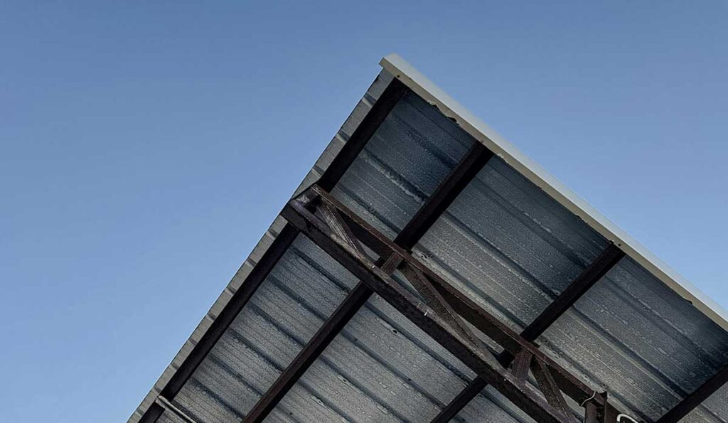 Installed metal roofing panels on a covered porch structure