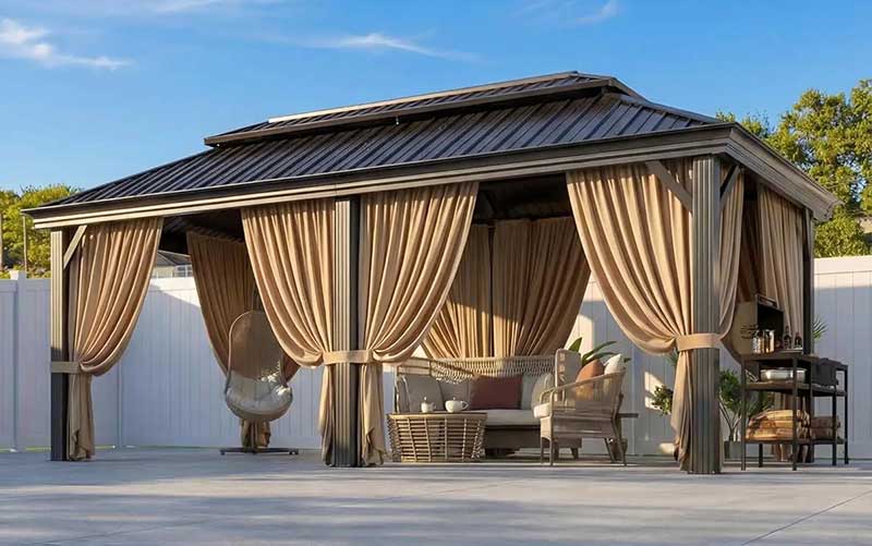 outdoor gazebo with curtains and mosquito netting on porch